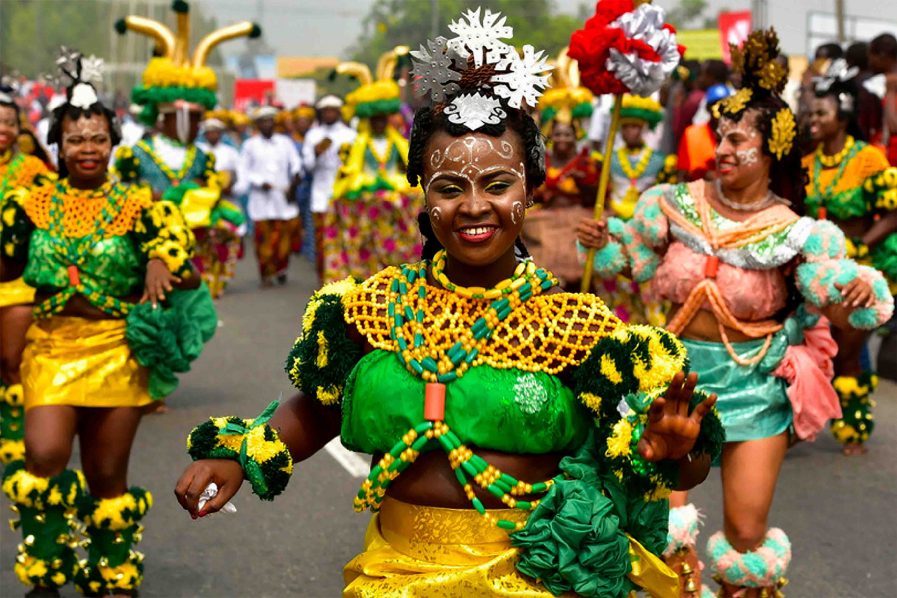 Cultural festival dancers in bright green and yellow dress