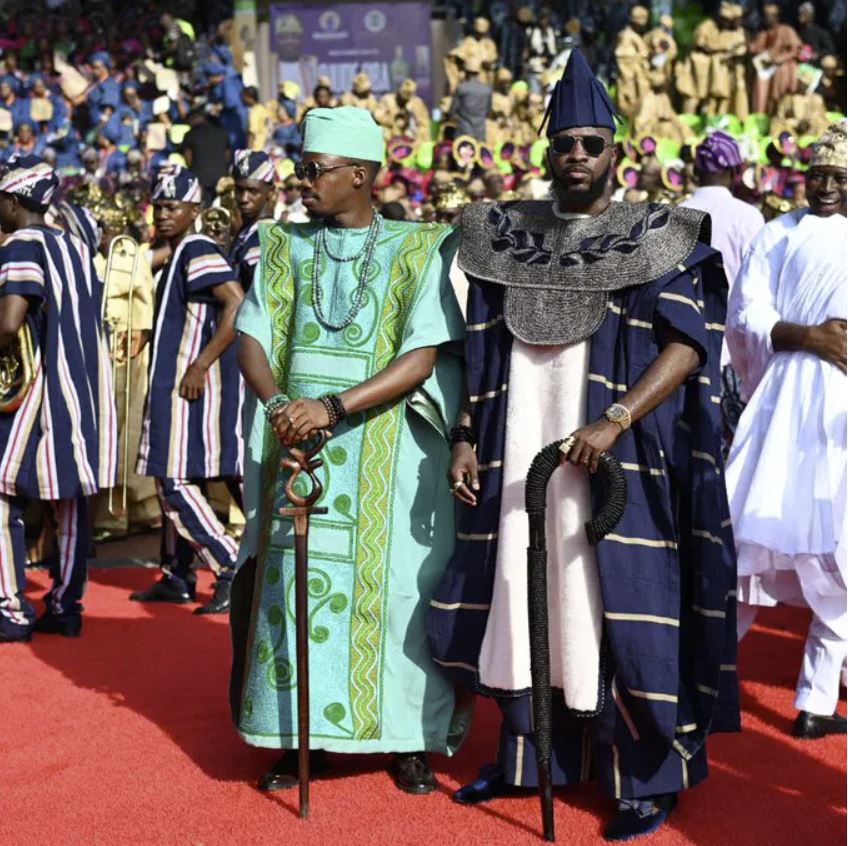 People in elegant traditional dress at a cultural event
